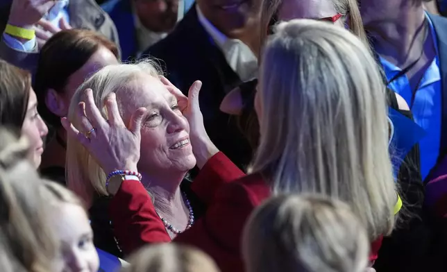 Democrat Abigail Spanberger, right, shares a moment with her mother after she was declared the winner of the Virginia governor's race during an election night watch party Tuesday, Nov. 4, 2025, in Richmond, Va. (AP Photo/Stephanie Scarbrough)