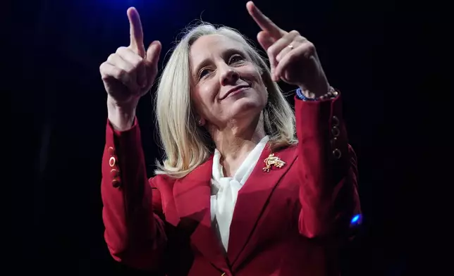 Democrat Abigail Spanberger points out at the crowd after she was declared the winner of the Virginia governor's race during an election night watch party Tuesday, Nov. 4, 2025, in Richmond, Va. (AP Photo/Stephanie Scarbrough)