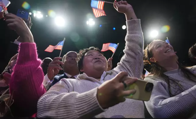 People cheer as Democrat Abigail Spanberger walks out on stage after she was declared the winner of the Virginia governor's race during an election night watch party Tuesday, Nov. 4, 2025, in Richmond, Va. (AP Photo/Stephanie Scarbrough)