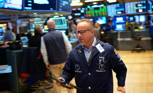 Robert Arciero works on the floor at the New York Stock Exchange in New York, Wednesday, Oct. 29, 2025. (AP Photo/Seth Wenig)