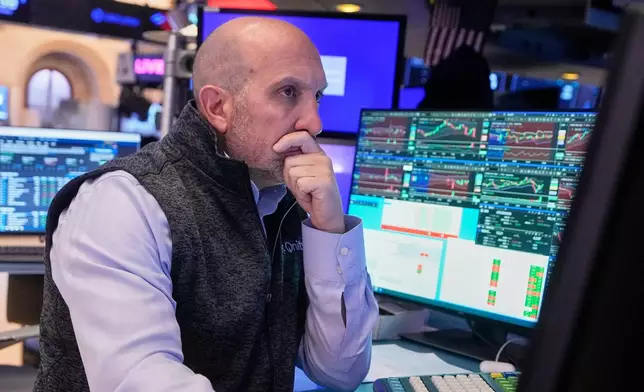 Specialist James Denaro works at his post on the floor of the New York Stock Exchange, Wednesday, Nov. 5, 2025. (AP Photo/Richard Drew)