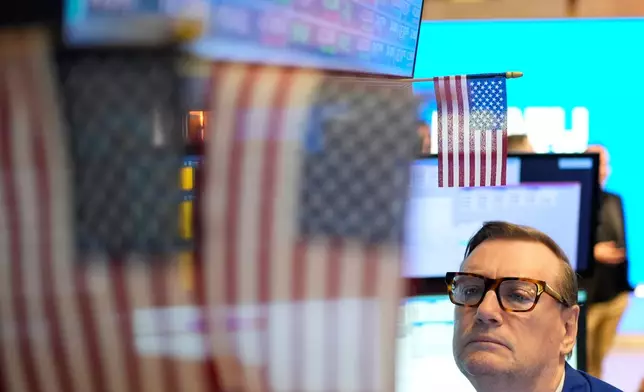Patrick King works on the floor at the New York Stock Exchange in New York, Wednesday, Oct. 29, 2025. (AP Photo/Seth Wenig)