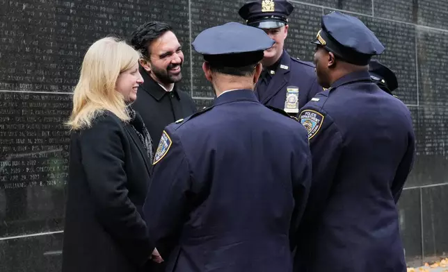 New York Mayor-elect Zohran Mamdani and New York City Police Commissioner Jessica Tisch meet with NYPD officers during their visit the New York City Police Memorial, Wednesday, Nov. 19, 2025. (AP Photo/Richard Drew)