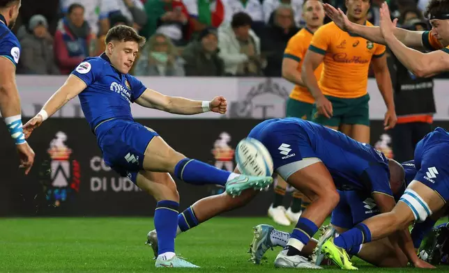 Italy's Stephen Varney kicks the ball during the rugby union match between Italy and Australia in Udine, Italy, Saturday, Nov. 8, 2025. (Andrea Bressanutti/LaPresse via AP)