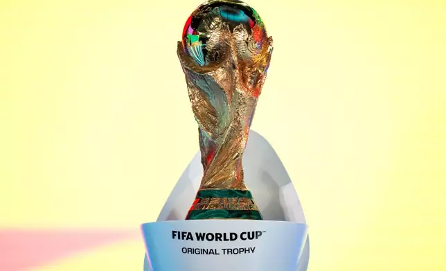 The FIFA World Cup Trophy is displayed during the FIFA World Cup 2026 playoff draw in Zurich, Switzerland, Thursday, Nov. 20, 2025. (Claudio Thoma/Keystone via AP)