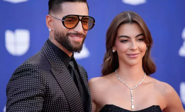 Maluma, left, and Susana Gomez arrive at the 2025 Latin Grammys on Thursday, Nov. 13, 2025, at MGM Grand in Las Vegas. (AP Photo/John Locher)