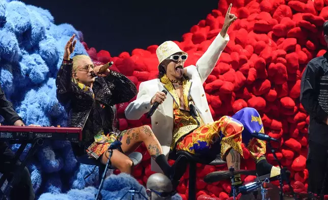 Paco Amoroso, left, and Ca7riel perform during the 2025 Latin Grammys on Thursday, Nov. 13, 2025, at MGM Grand in Las Vegas. (AP Photo/Chris Pizzello)