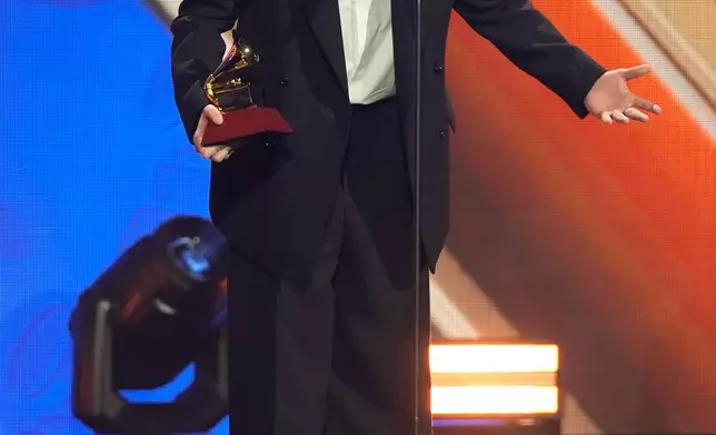 Bad Bunny accepts the award for best urban music album for "DeBí TiRAR MáS FOToS" during the 2025 Latin Grammys on Thursday, Nov. 13, 2025, at MGM Grand in Las Vegas. (AP Photo/Chris Pizzello)