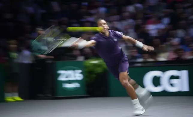 Canada's Felix Auger-Aliassime returns to Monaco's Valentin Vacherot during their quarterfinal match of the Paris Masters tennis tournament in Paris, Friday, Oct. 31, 2025. (AP Photo/Christophe Ena)