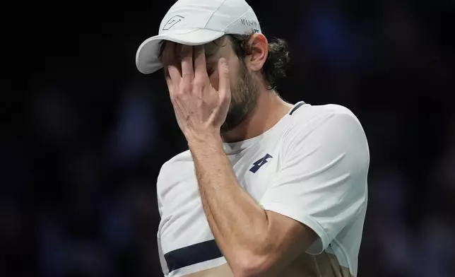 Monaco's Valentin Vacherot reacts during quarterfinal match of the Paris Masters tennis tournament against Canada's Felix Auger-Aliassime in Paris, Friday, Oct. 31, 2025. (AP Photo/Christophe Ena)