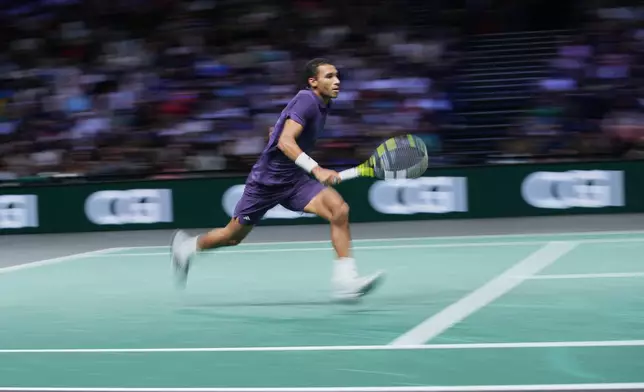 Canada's Felix Auger-Aliassime runs during quarterfinal match of the Paris Masters tennis tournament against Monaco's Valentin Vacherot in Paris, Friday, Oct. 31, 2025. (AP Photo/Christophe Ena)