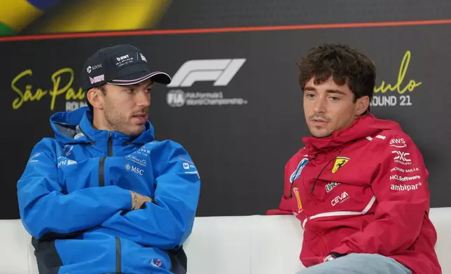 Alpine driver Pierre Gasly, of France, left, talks with Ferrari driver Charles Leclerc, of Monaco, during a press conference ahead of the Brazilian Formula One Grand Prix at the Interlagos race track in Sao Paulo, Thursday, Nov. 6, 2025. (AP Photo/Andre Penner)
