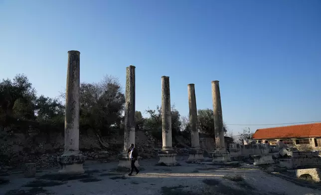 Palestinian Muhammad Azem, the mayor of Sebastia, inspects the Roman historical site in the West Bank town of Sebastia Thursday, Nov. 20, 2025. (AP Photo/Nasser Nasser)
