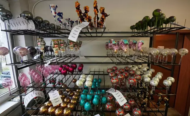 The hand-made Christmas baubles are prepared at GlitterLab in Czestochowa, southern Poland, on Nov. 21, 2025. (AP Photo/Czarek Sokolowski)