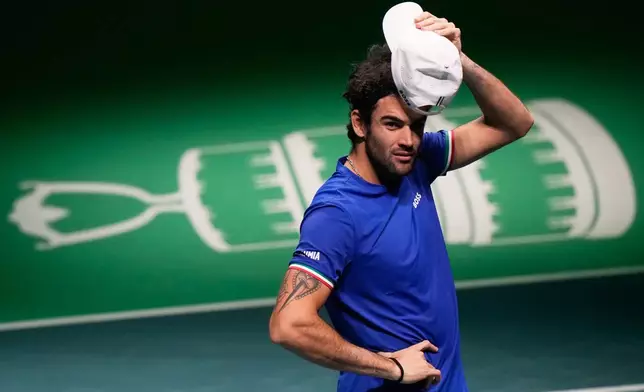 Italy's Matteo Berrettini celebrates after winning a Davis Cup semifinal singles tennis match between Italy and Belgium against Belgium's Raphael Collignon in Bologna, Italy, Friday, Nov. 21, 2025. (AP Photo/Luca Bruno)