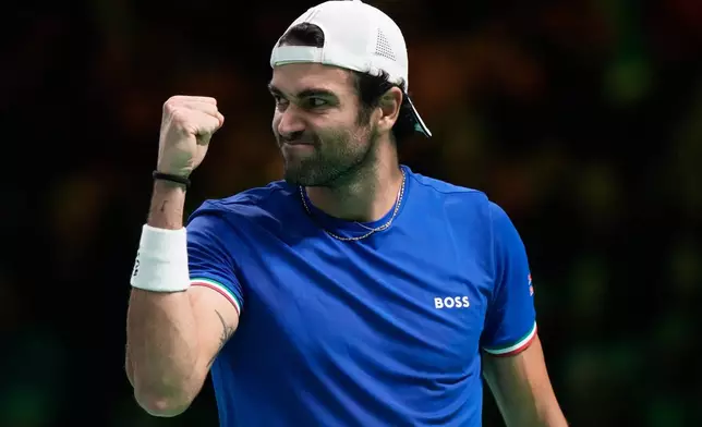 Italy's Matteo Berrettini reacts after winning a point to Belgium's Raphael Collignon during a Davis Cup semifinal singles tennis match between Italy and Belgium, in Bologna, Italy, Friday, Nov. 21, 2025. (AP Photo/Luca Bruno)