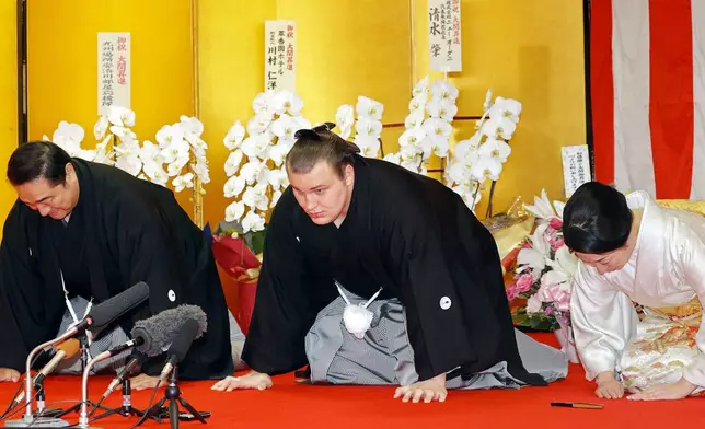 Ukrainian sumo wrestler Aonishiki, center, makes a speech as he is promoted to the rank of ozeki in Kurume, Fukuoka prefecture, southern Japan Wednesday, Nov. 26, 2025. (Kyodo News via AP)