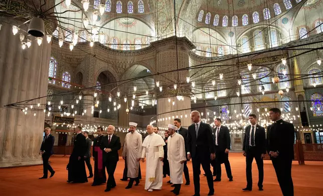 Pope Leo XIV visits the Ottoman-era Sultan Ahmed or Blue Mosque, in Istanbul, Turkey, Saturday, Nov. 29, 2025. (AP Photo/Emrah Gurel)