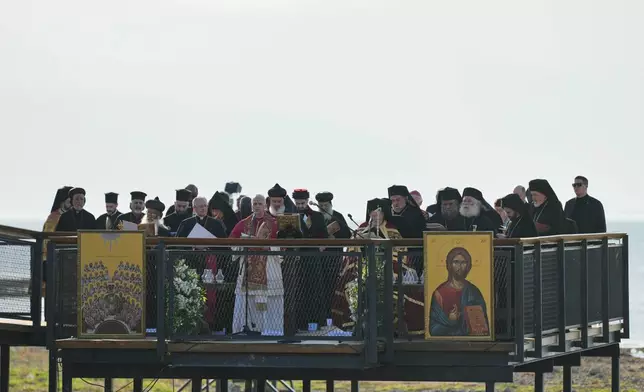 Pope Leo XIV and Ecumenical Patriarch Bartholomew I, the spiritual leader of the world's Eastern Orthodox Christians lead an Ecumenical prayer service at archaeological excavations of the ancient Byzantine-era Christian Saint Neophytos Basilica, in Iznik, Turkey, Friday, Nov. 28, 2025, marking the 1,700 years anniversary of the Council of Nicaea. (AP Photo/Khalil Hamra)