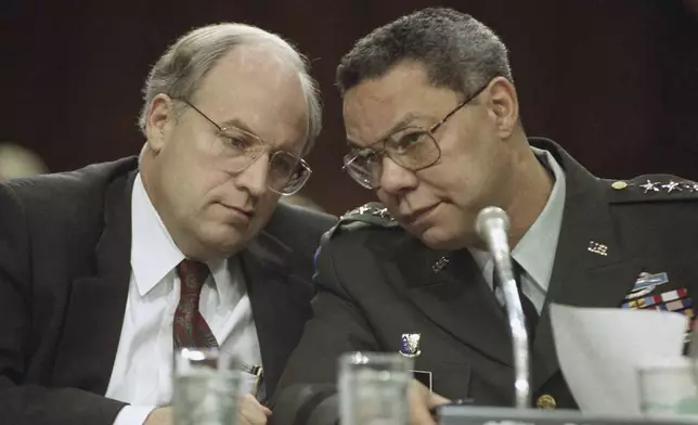 FILE - Secretary of Defense Dick Cheney, left, and Chairman of the Joint Chiefs, Gen. Colin Powell, huddle prior to testifying before the Senate Armed Services Committee, Thursday, Feb. 21, 1991 on Capitol Hill in Washington. (AP Photo/John Duricka, file)