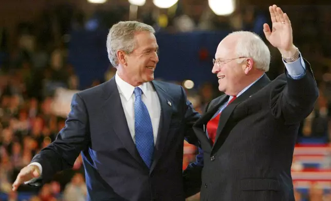 FILE - President Bush and Vice President Dick Cheney embrace following President Bush's acceptance speech in Madison Square Garden during the final night of the Republican National Convention Thursday, Sept. 2, 2004, in New York. (AP Photo/Charles Dharapak, file)