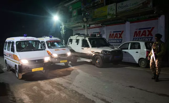 Ambulances leave the site of an explosion inside a police station in Srinagar, Indian controlled Kashmir, Friday, Nov. 14, 2025. (AP Photo/Yasin Dar)