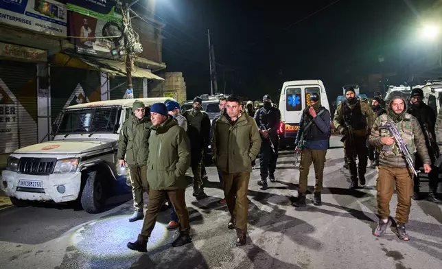 Indian police officers patrol near the site of an explosion inside a police station in Srinagar, Indian controlled Kashmir, Friday, Nov. 14, 2025. (AP Photo/Yasin Dar)