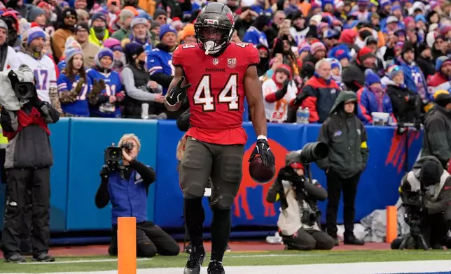 Tampa Bay Buccaneers running back Sean Tucker (44) celebrates after scoring a touchdown against the Buffalo Bills during the second half of an NFL football game, Sunday, Nov. 16, 2025, in Orchard Park, N.Y. (AP Photo/Carolyn Kaster)