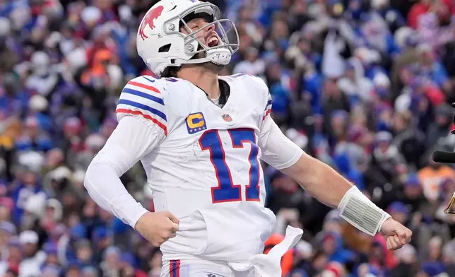 Buffalo Bills quarterback Josh Allen celebrates after scoring a touchdown against the Tampa Bay Buccaneers during the second half of an NFL football game, Sunday, Nov. 16, 2025, in Orchard Park, N.Y. (AP Photo/Carolyn Kaster)