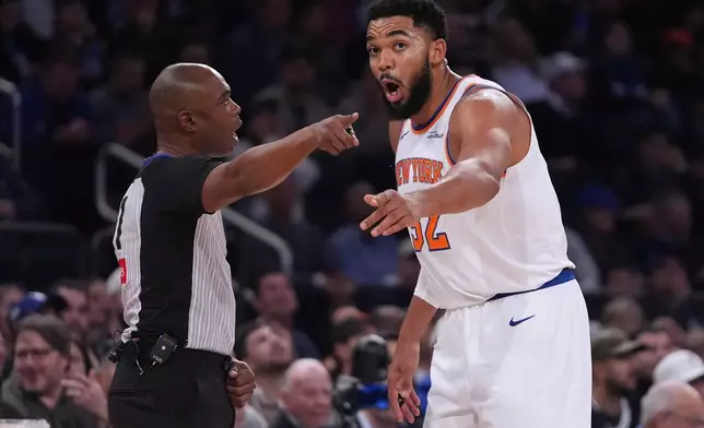 New York Knicks' Karl-Anthony Towns (32) argues a call with referee Courtney Kirkland (61) during the first half of an NBA basketball game against the Orlando Magic Wednesday, Nov. 12, 2025, in New York. (AP Photo/Frank Franklin II)