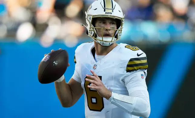 New Orleans Saints quarterback Tyler Shough passes against the Carolina Panthers during the second half of an NFL football game, Sunday, Nov. 9, 2025, in Charlotte, N.C. (AP Photo/Jacob Kupferman)