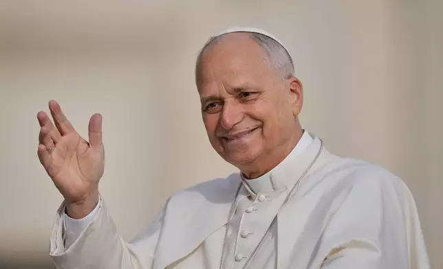 Pope Leo XIV arrives for an audience on the occasion of the Jubilee of the Choirs in St. Peter's Square, at the Vatican, Saturday, Nov. 22, 2025. (AP Photo/Alessandra Tarantino)