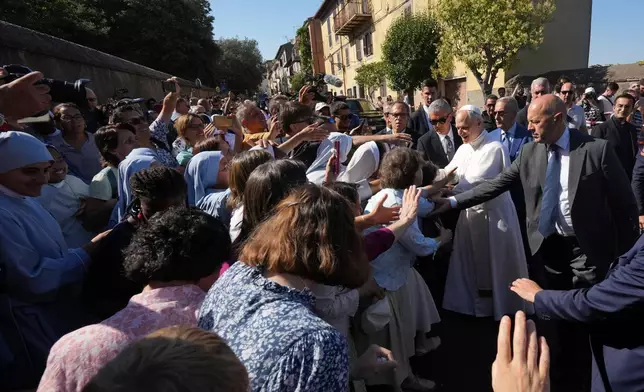 FILE - Pope Leo XIV arrives at the papal summer residence in Castel Gandolfo, south of Rome, for a six-week vacation, Sunday, July 6, 2025. (AP Photo/Andrew Medichini, File)