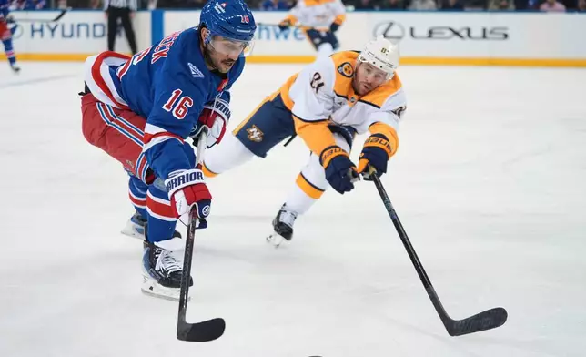 New York Rangers' Vincent Trocheck (16) drives past Nashville Predators' Jonathan Marchessault (81) during the first period of an NHL hockey game Monday, Nov. 10, 2025, in New York. (AP Photo/Frank Franklin II)