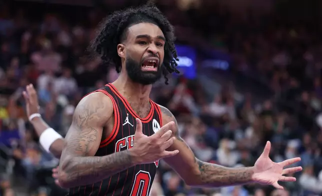 Chicago Bulls guard Coby White reacts to a call against the Utah Jazz during the second overtime of an NBA basketball game, Sunday, Nov. 16, 2025, in Salt Lake City. (AP Photo/Rob Gray)