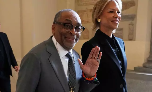 Film Director Spike Lee and his wife Tonya Lewis Lee leave at the end of an audience of Pope Leo XIV with actors and directors from the cinema, at the Vatican, Saturday, Nov. 15, 2025. (AP Photo/Gregorio Borgia)