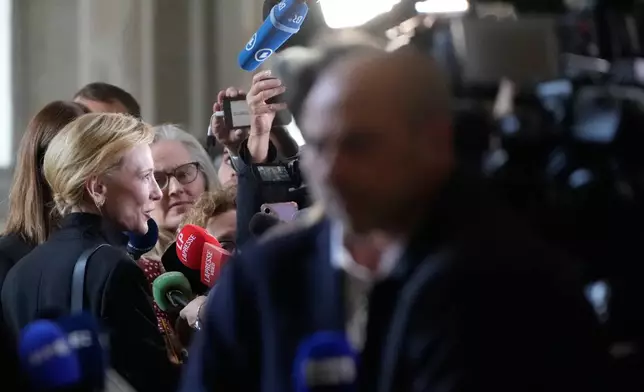 Cate Blanchett is interviewed by journalists as she leaves at the end of an audience of Pope Leo XIV with actors and directors from the cinema at the Vatican, Saturday, Nov. 15, 2025. (AP Photo/Gregorio Borgia)