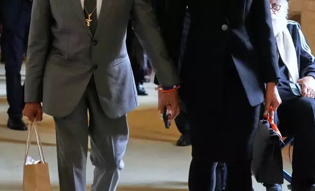 Film Director Spike Lee and his wife Tonya Lewis Lee leave after an audience of Pope Leo XIV with actors and directors from the cinema at the Vatican, Saturday, Nov. 15, 2025. (AP Photo/Gregorio Borgia)