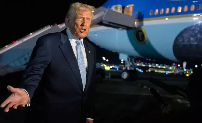 President Donald Trump speaks to reporters before boarding Air Force One at Palm Beach International Airport in West Palm Beach Fla., on his way back to the White House, Sunday, Nov. 16, 2025. (AP Photo/Manuel Balce Ceneta)