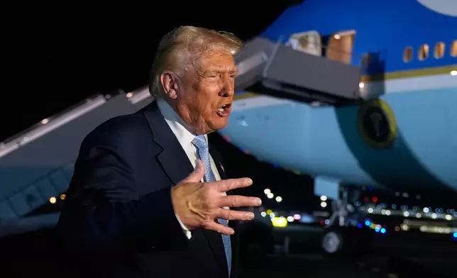 President Donald Trump speaks to reporters before boarding Air Force One at Palm Beach International Airport in West Palm Beach Fla., on his way back to the White House, Sunday, Nov. 16, 2025. (AP Photo/Manuel Balce Ceneta)