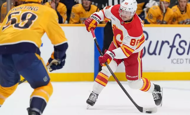 Calgary Flames left wing Joel Farabee (86) shoots the puck during the first period of an NHL hockey game against the Nashville Predators, Saturday, Nov. 1, 2025, in Nashville, Tenn. (AP Photo/Camden Hall)