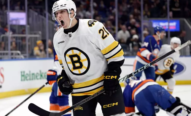Boston Bruins center Alex Steeves reacts after scoring a goal past New York Islanders goaltender Ilya Sorokin in the first period of an NHL hockey game, Wednesday, Nov. 26, 2025, in Elmont, N.Y. (AP Photo/Adam Hunger)