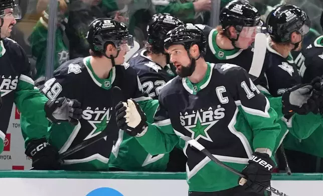 Dallas Stars left wing Jamie Benn (14) celebrates scoring a goal during the second period of an NHL hockey game against the Utah Mammoth Friday, Nov. 28, 2025, in Dallas. (AP Photo/LM Otero)