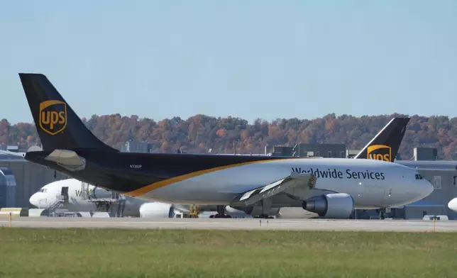UPS jets are parked at the Worldport package sorting complex at Louisville Muhammad Ali International Airport, Thursday, Nov. 6, 2025, in Louisville, Ky. (AP Photo/Darron Cummings)