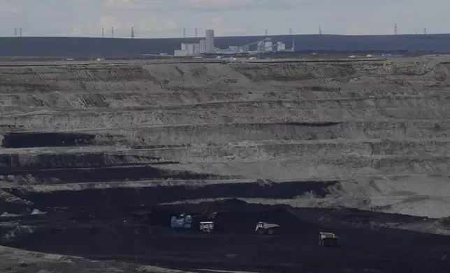 FILE - Trucks operate in the Huaneng Yimin open-pit coal mine in Hulunbuir in northern China's Inner Mongolia province China, Sept. 15, 2025. (AP Photo/Ng Han Guan, File)
