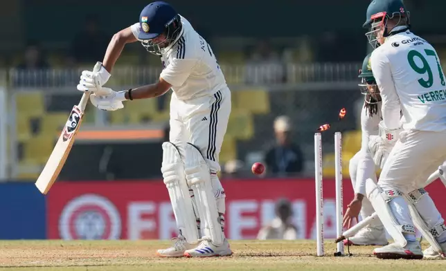 India's Kuldeep Yadav bowled out by South Africa's Simon Harmer on the fifth day of the second cricket test match between India and South Africa in Guwahati, India, Saturday, Nov. 22, 2025. (AP Photo/Anupam Nath)
