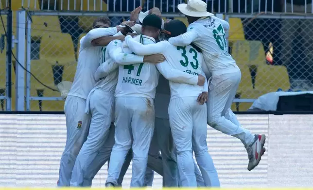 South Africa's players celebrate after South Africa wins the test series against India in Guwahati, India, Saturday, Nov. 22, 2025. (AP Photo/Anupam Nath)