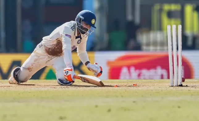 India's Ravindra Jadeja dives to reach the crease after stumped out on the fifth day of the second cricket test match between India and South Africa in Guwahati, India, Saturday, Nov. 22, 2025. (AP Photo/Anupam Nath)