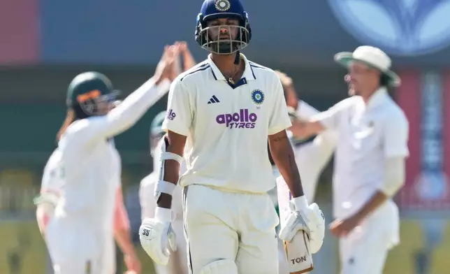 India's Washington Sundar walks off the field after losing his wicket on the fifth day of the second cricket test match between India and South Africa in Guwahati, India, Saturday, Nov. 22, 2025. (AP Photo/Anupam Nath)