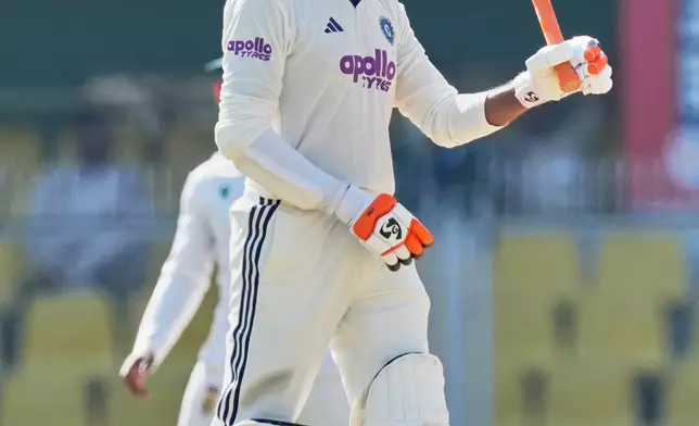 India's Ravindra Jadeja celebrates after scoring fifty runs on the fifth day of the second cricket test match between India and South Africa in Guwahati, India, Saturday, Nov. 22, 2025. (AP Photo/Anupam Nath)